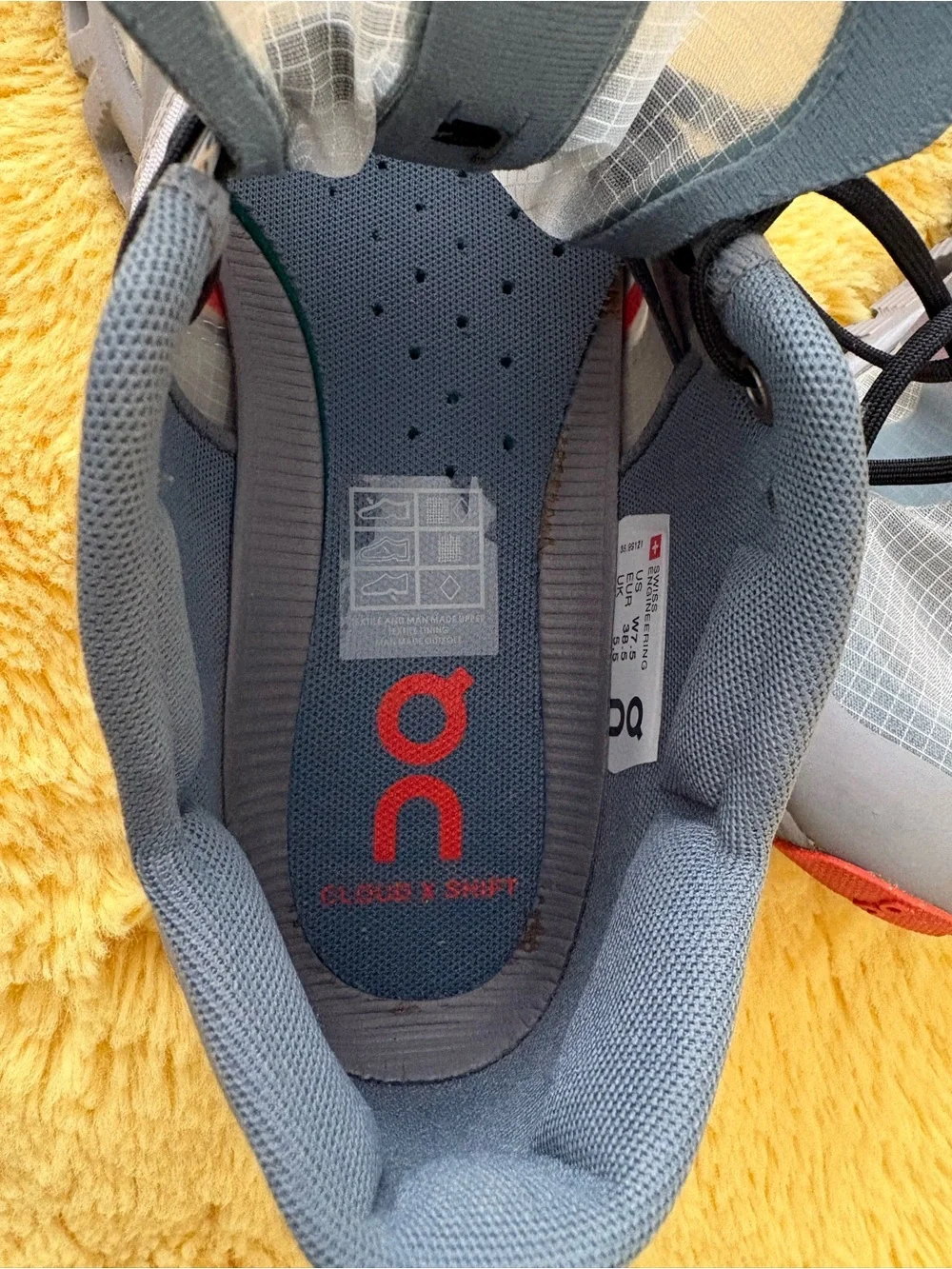On Running Gray and Red Trail Runners